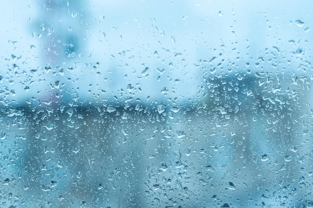 Bad weather day rain on glass Condensation on clear glass window Water drops Rain Abstract background texture