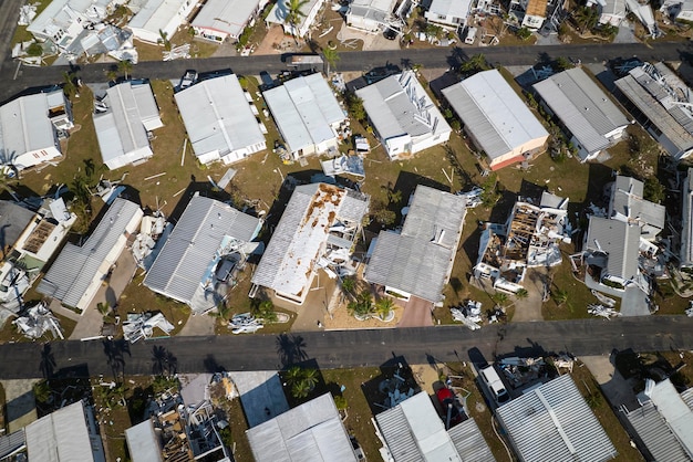 Badly damaged mobile homes after hurricane Ian in Florida residential area Consequences of natural disaster