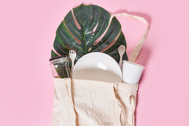 A bag filled with utensils and a plant