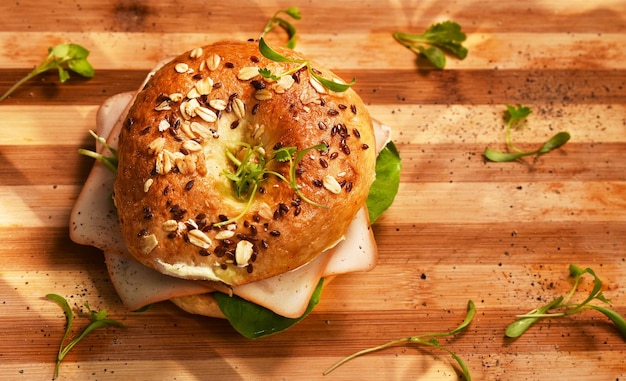 A bagel with a green leaf on it