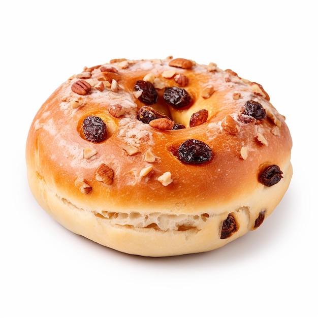 a bagel with raisins on it with a white background