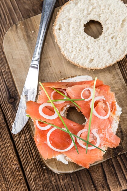 Bagel with Salmon on wooden background