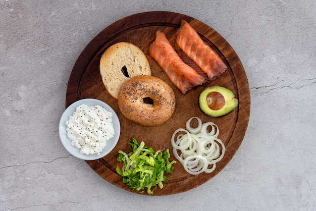 Bagels and ingredients for sandwich on table