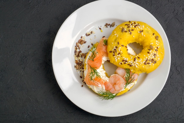 Bagels with cream cheese, salmon,  shrimp.