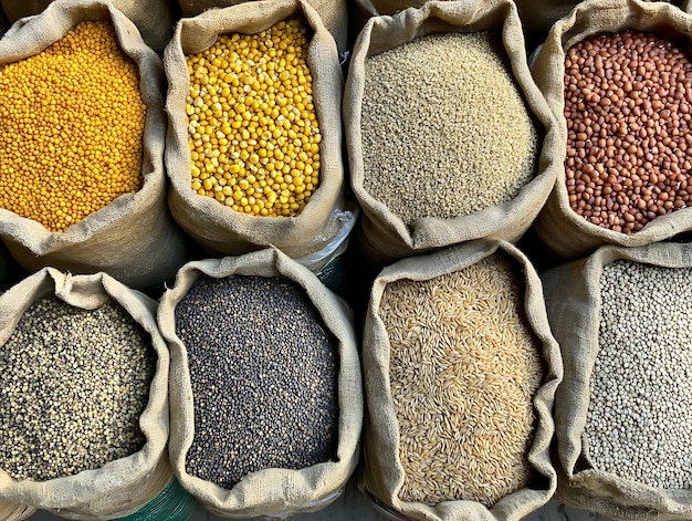 Photo bags of spices including beans beans and grains are lined up