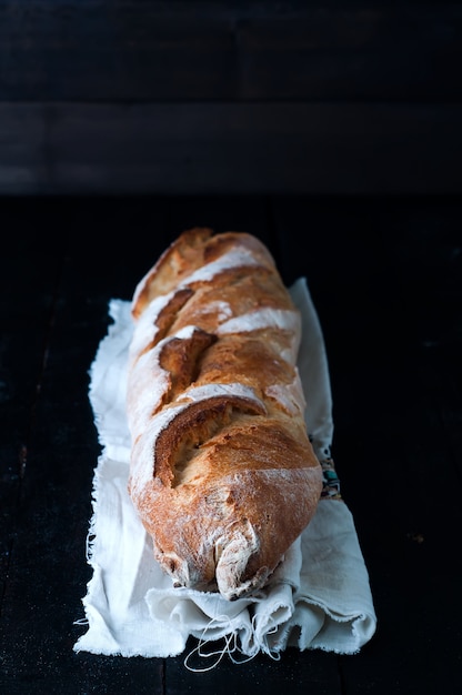 Baguette on black background.