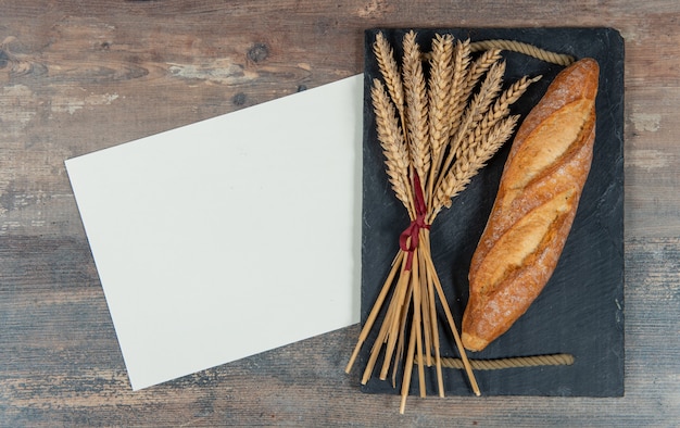 Baguette or French bread and some wheat ears