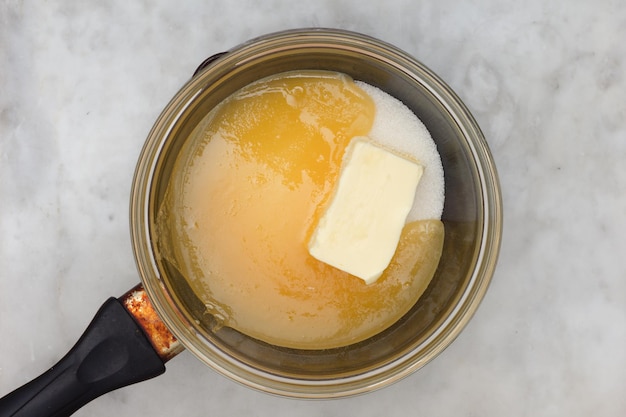 Bainmarie with sugar butter and honey on saucepan