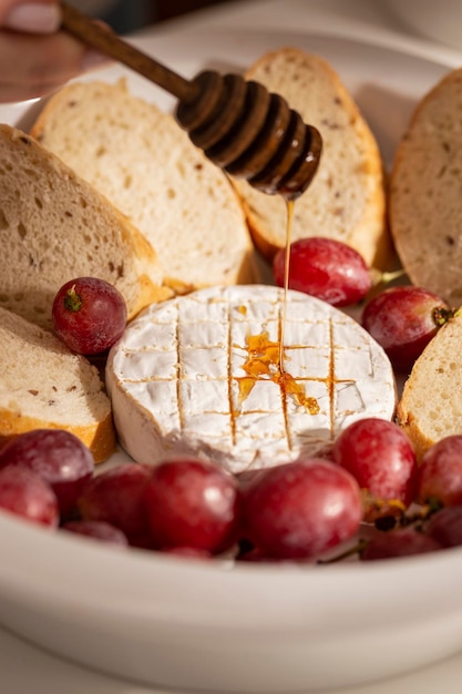 Baked brie cheese with grilled bread for dinner