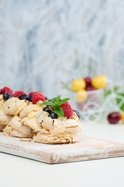 A baked cake made from whipped chicken protein and cream decorated with fresh berries