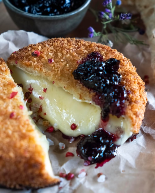 Baked camembert cheese with jam Closeup