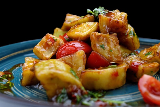 Baked caramelized eggplant with tomatoes and herbs