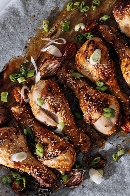 Baked chicken drumsticks with sesame honey and soy sauce onion and spices