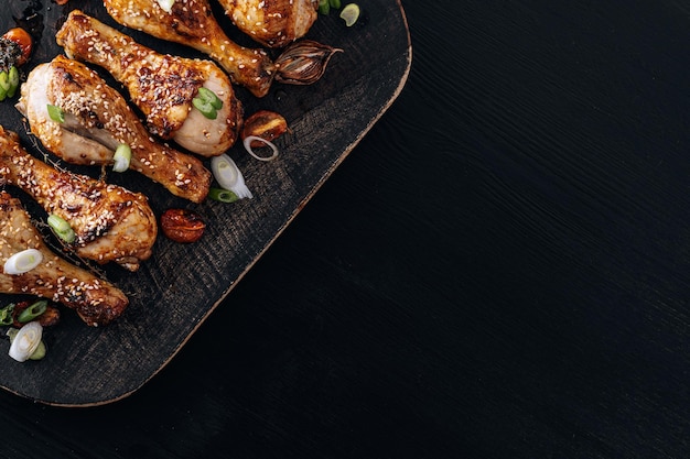 Baked chicken drumsticks with sesame honey and soy sauce onion and spices