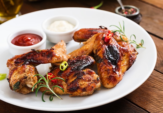 Baked chicken wings in the Asian style on plate.