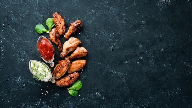 Photo baked chicken wings barbecue top view free space for your text