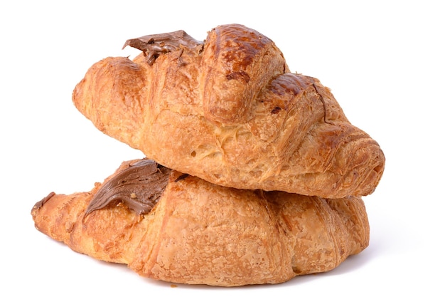 A baked chocolate croissant on a white isolated background a delicious dessert and breakfast