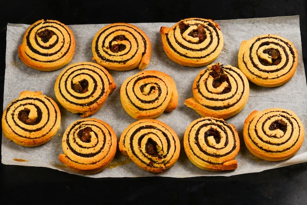 Baked cookies with raisins and poppy seeds on a trail