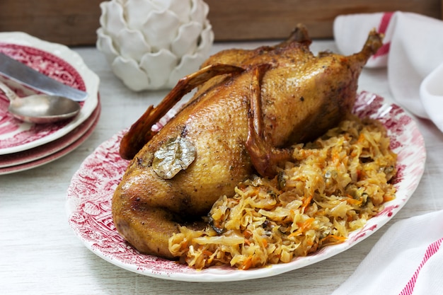 Baked duck with cabbage in a festive decoration. Rustic style.