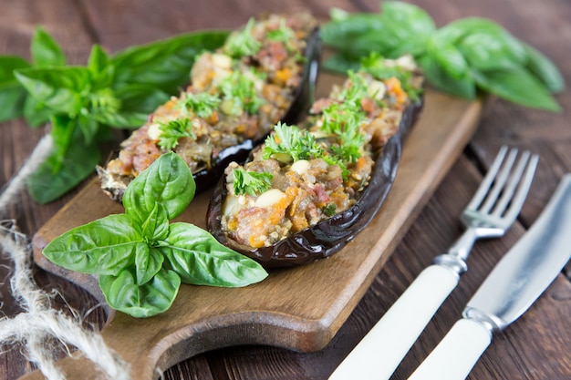 Baked eggplant stuffed with vegetables, meat and cheese