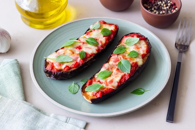 Baked eggplant with cheese mozzarella tomatoes and basil Healthy eating Italian food Parmigiana di melanzane