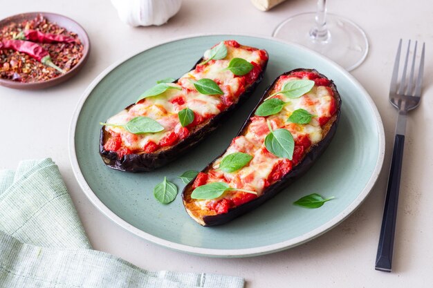 Baked eggplant with cheese mozzarella tomatoes and basil Healthy eating Italian food Parmigiana di melanzane