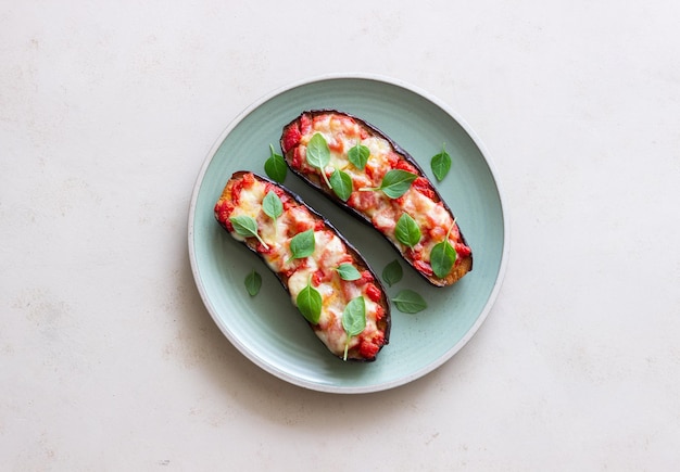 Baked eggplant with cheese mozzarella tomatoes and basil Healthy eating Italian food Parmigiana di melanzane