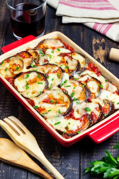 Baked eggplant with cheese mozzarella and tomatoes Healthy eating Italian food Parmigiana di melanzane