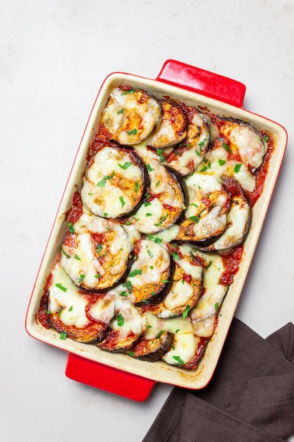 Baked eggplant with cheese mozzarella and tomatoes Healthy eating Italian food Parmigiana di melanzane