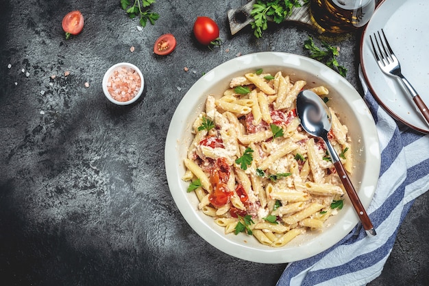 Baked feta cheese with tomatoes and pasta, garlic. Fetapasta