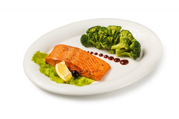 Baked fish salmon garnished with broccoli