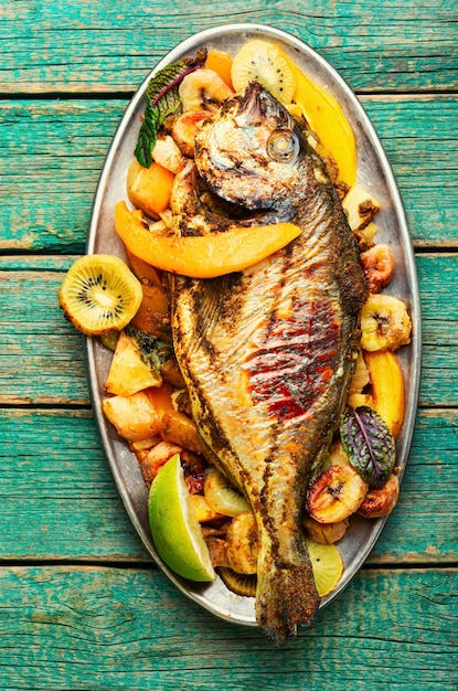 Baked fish with pineapple mango and kiwi