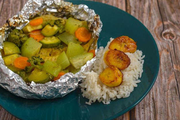 Baked fish with vegetables in aluminum foil Healthy food