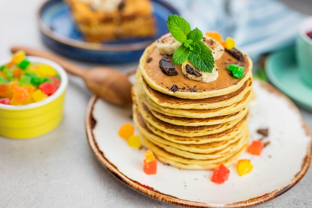 baked food pancakes lush bunch lots with banana chocolate and candied fruit