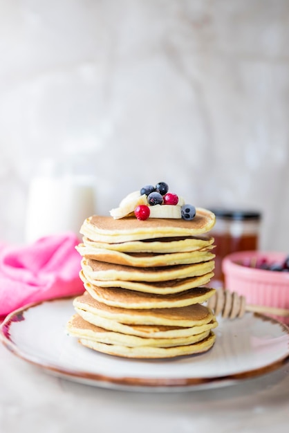 baked food pancakes lush pile a lot with banana and berries