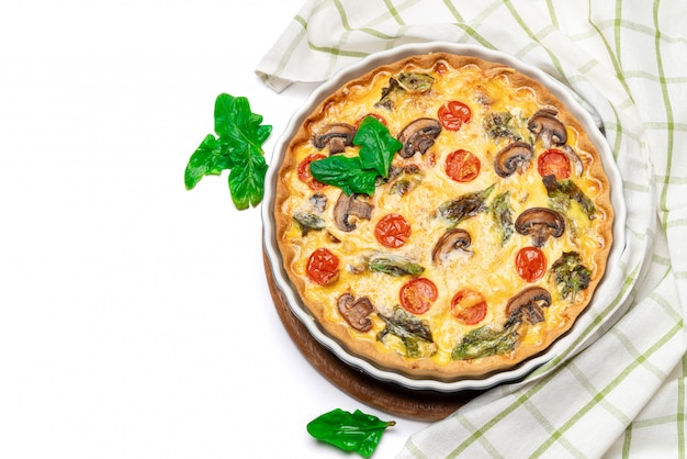 Baked homemade quiche pie in ceramic baking form