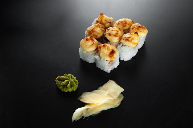 Baked hot sushi rolls on a dark background Hot fried Sushi Roll Sushi menu Japanese food