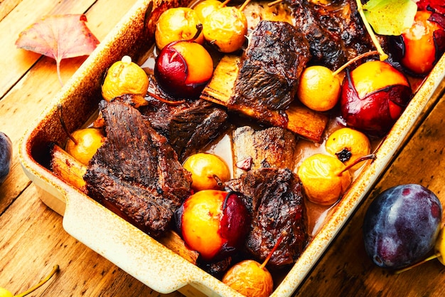 Baked lamb ribs with fruit sauce