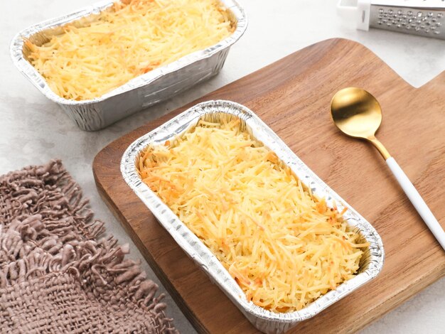 Baked Macaroni Schotel in an aluminium foil cup Selective focus