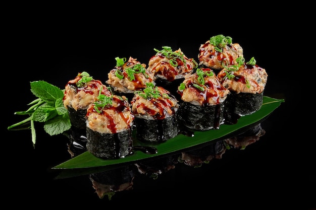 Baked maki sushi roll with eel cream cheese cucumber and unagi sauce