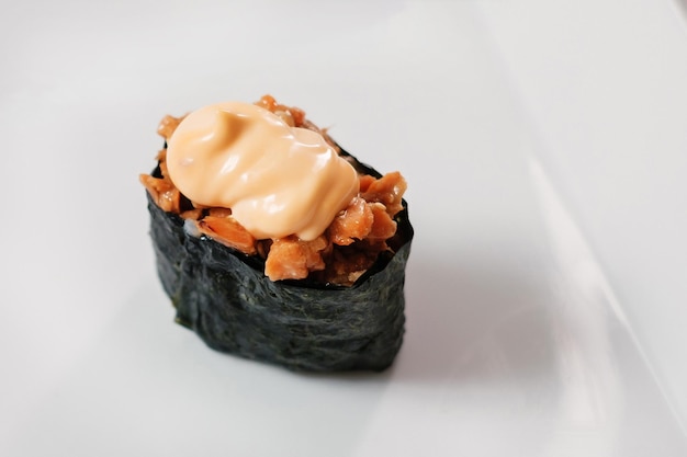 Baked maki sushi rolls with salmon Copyspace