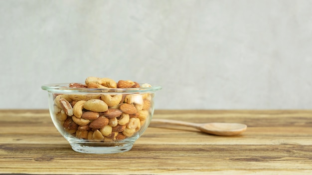 Baked mixed nuts on a wooden table