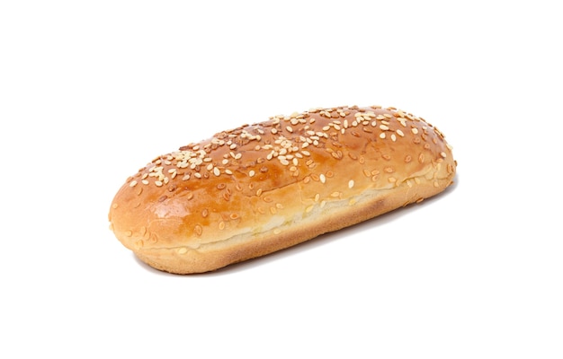 Baked oblong sesame hot dog bun isolated on white background