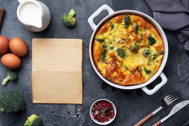 Baked omelette with broccoli in a ceramic dish