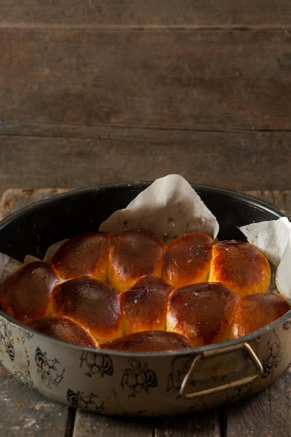 Baked pies in a pan on wooden boards Cooking