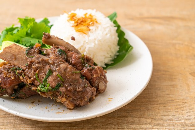 Baked pork ribs with sauce and rice