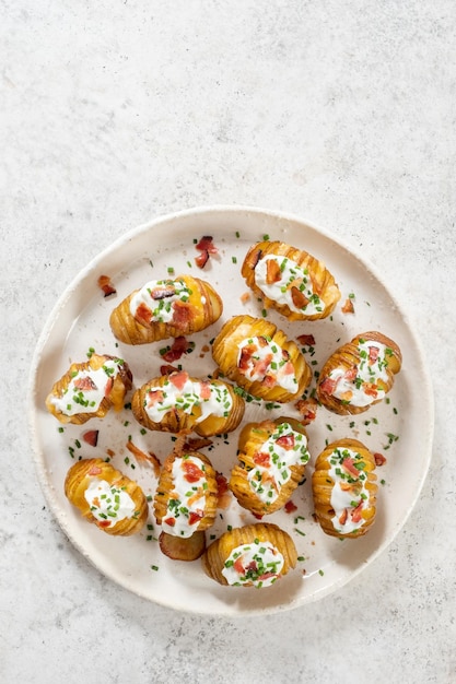 Baked potato stuffed with cheese bacon and sour cream