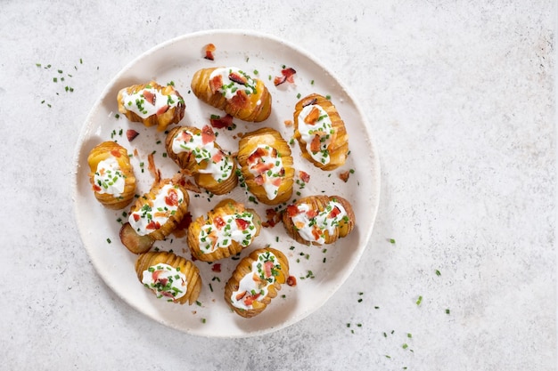 Baked potato stuffed with cheese bacon and sour cream