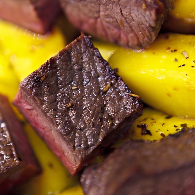 Baked potato with a piece of beef.