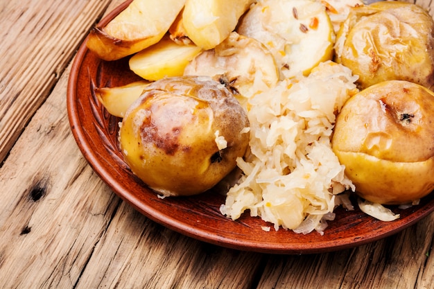 Baked potatoes, apples and sauerkraut.